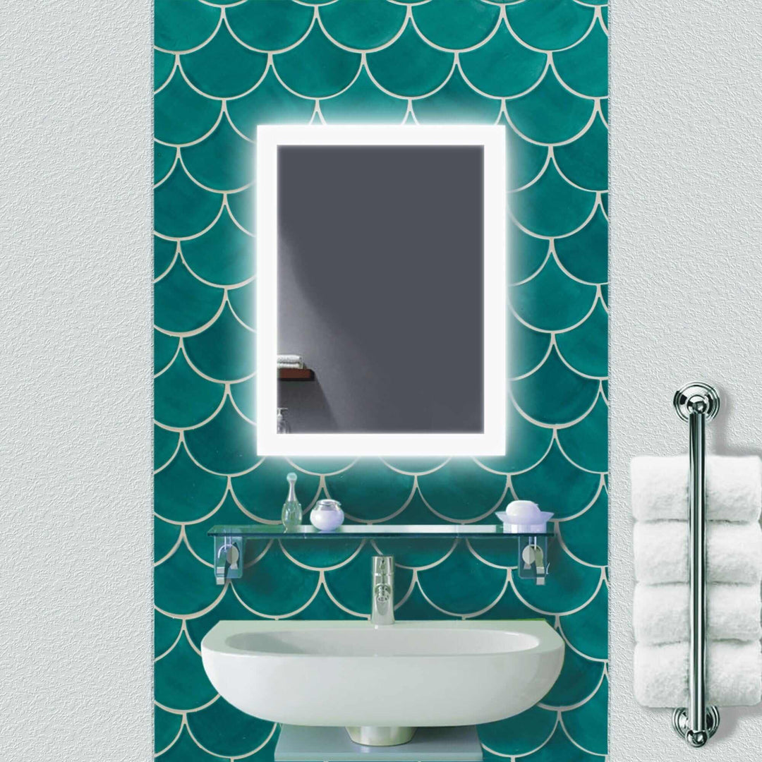 Krugg Bijou 15 X 30 bathroom mirror with dimming feature reflecting a white bathtub