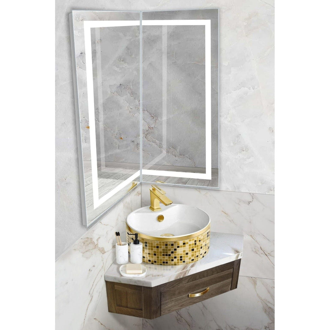 Krugg Modular 18 x 36 Corner LED Mirror - Left or Right installed in a bathroom above a gold-trimmed round sink and vanity